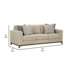93-inch sofa, includes 4 decorative throw pillows, faux wood legs, and beige polyester fabric.